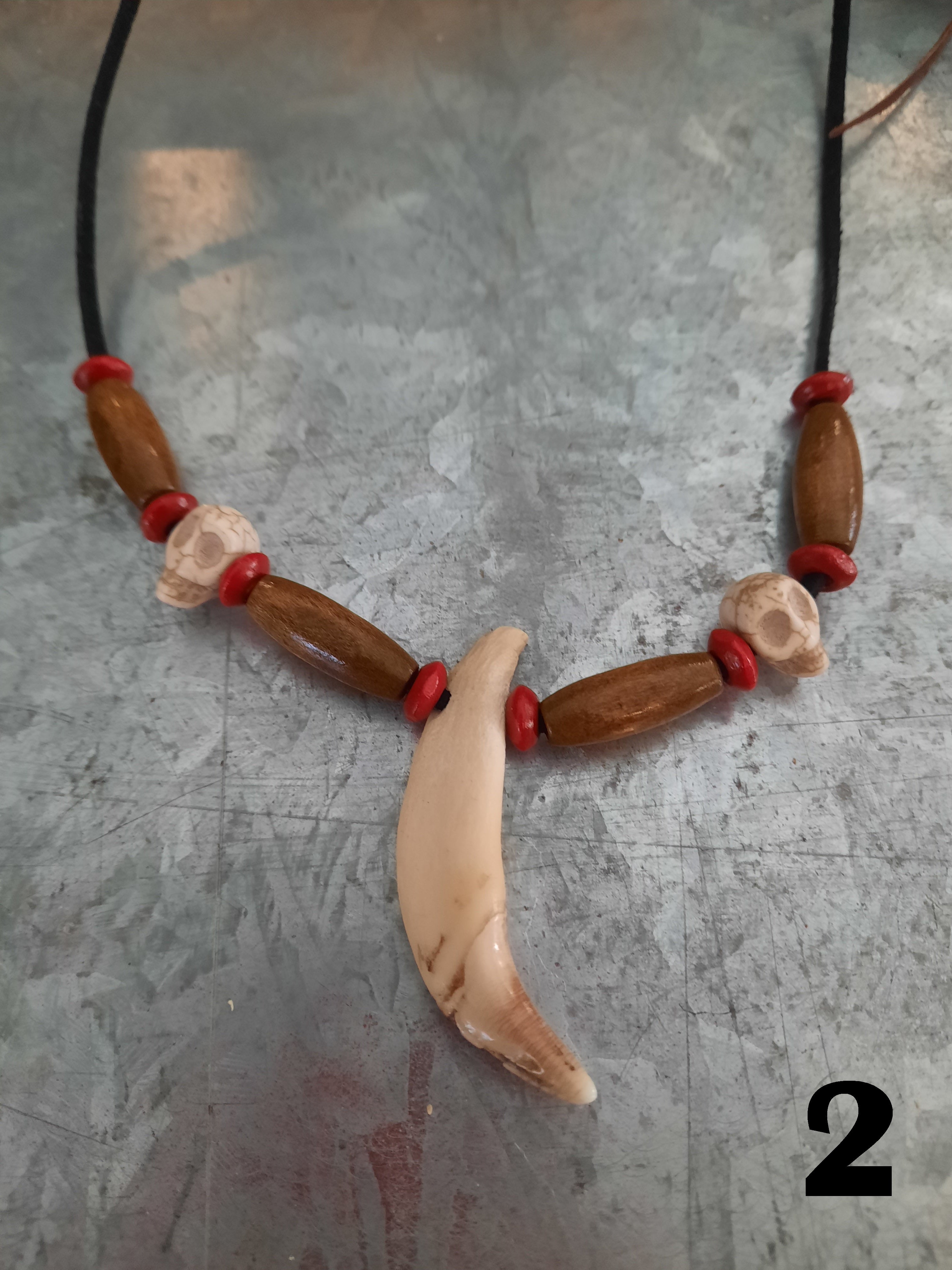 Pig 2025 tooth necklace